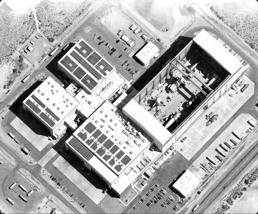 Watercolor aerial view of an industrial facility